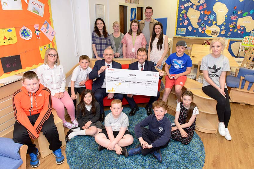 Staff presenting the cheque to the group at Barnardos Nurture Service Inverclyde.