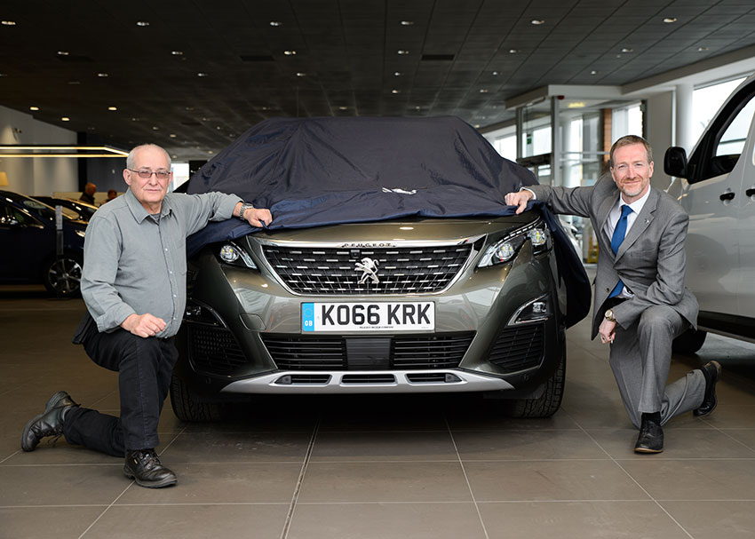 Alex Munro collected his prize from Inverness Peugeot last week