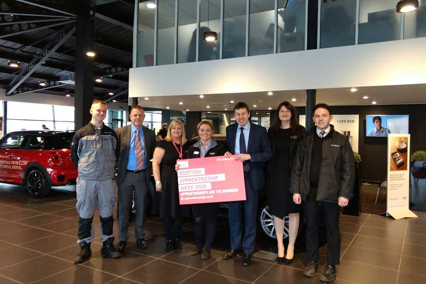 Ken MacIntosh MSP with apprentices and staff at Giffnock MINI
