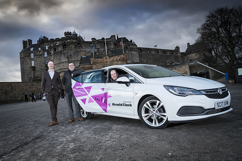 Stuart with the Vauxhall Astra and some of his colleagues from the charity