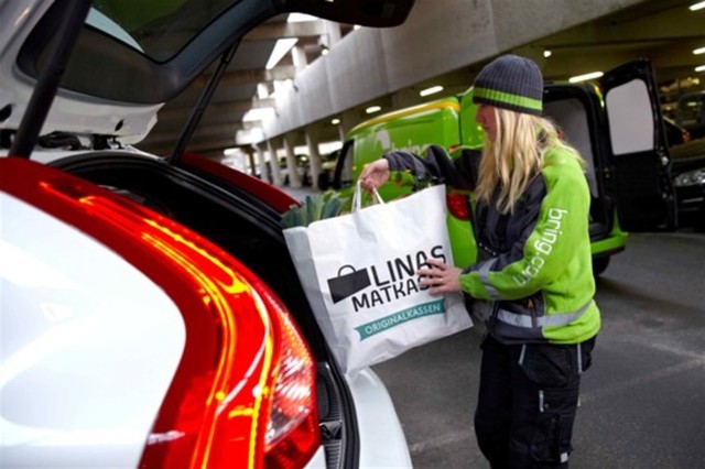 Select your car as a 'delivery option' and then use a digital key to give couriers access