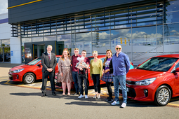 Winning Glasgow Kiltwalkers collect new cars at Arnold Clark head office
